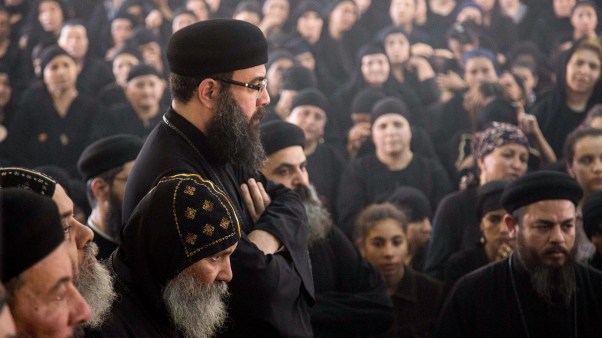 Prayers in Deir El-Garnouse Coptic church in Egypt for victims of a terrorist attack.